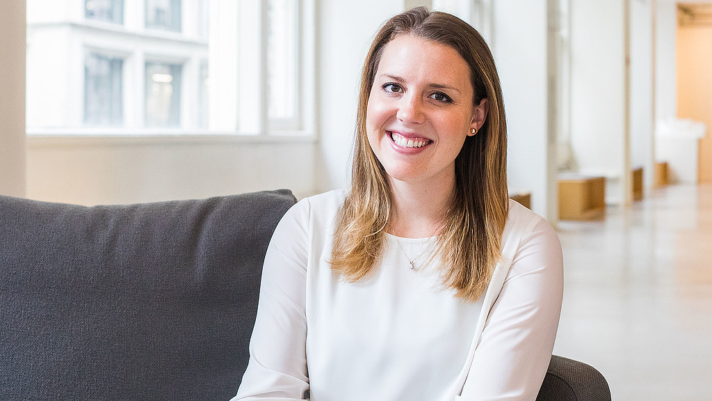 A woman sitting on a couch.