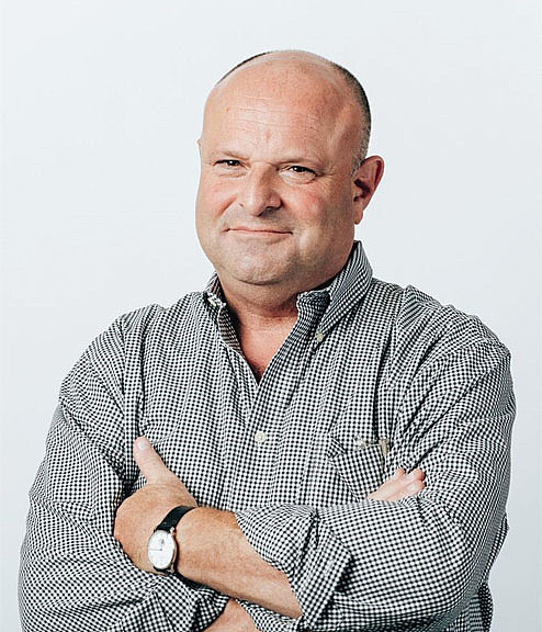 A man with his arms crossed.