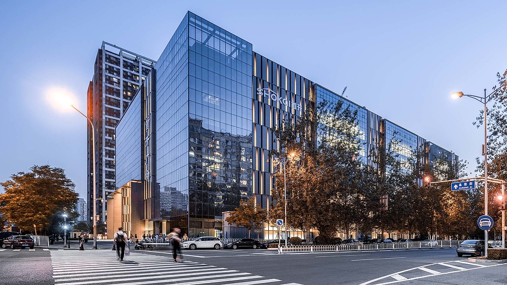 A large glass building with many windows.