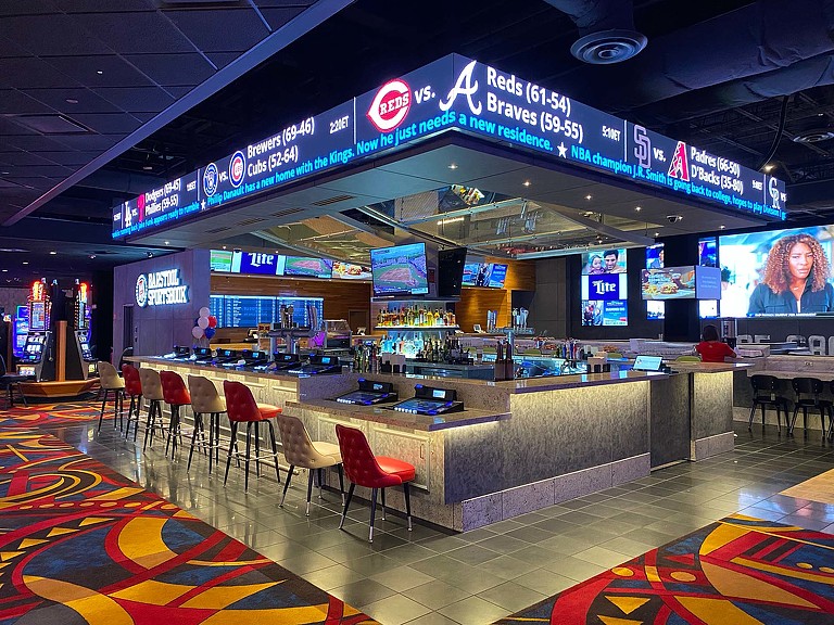 A restaurant with a large sign.