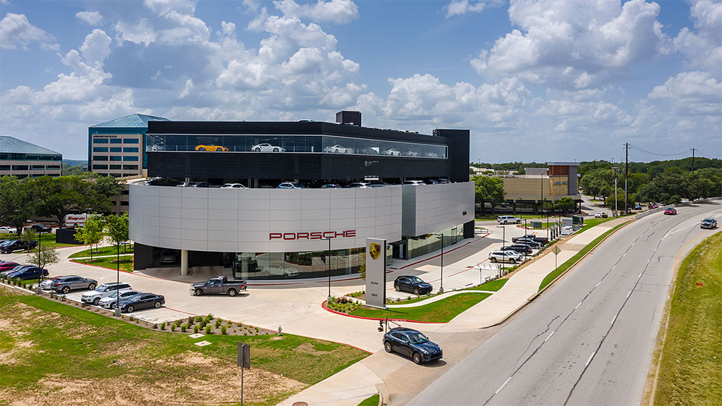 A building with cars parked in front.