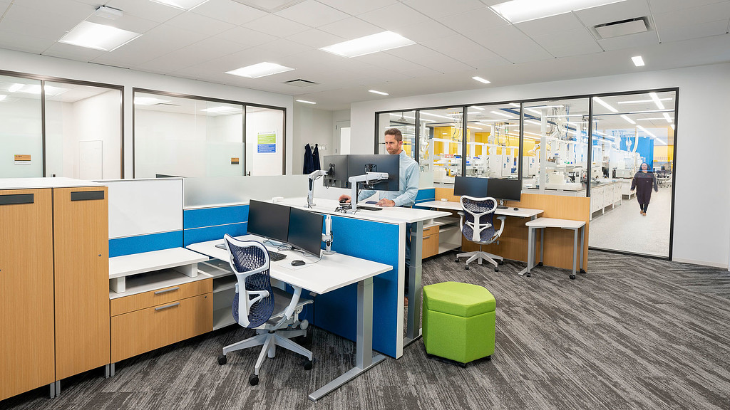 A person standing in an office.