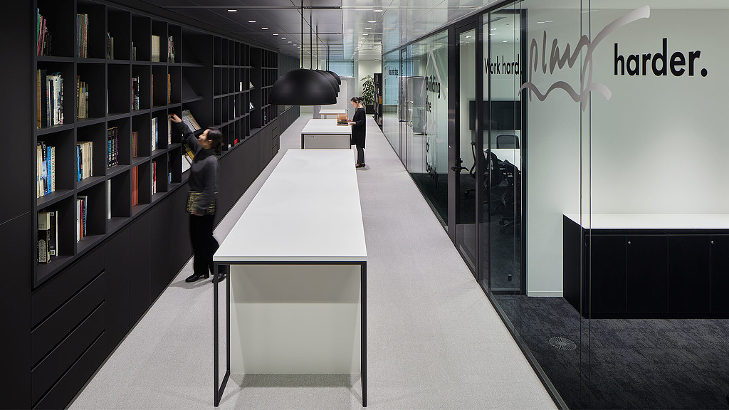 A man and woman in a library.