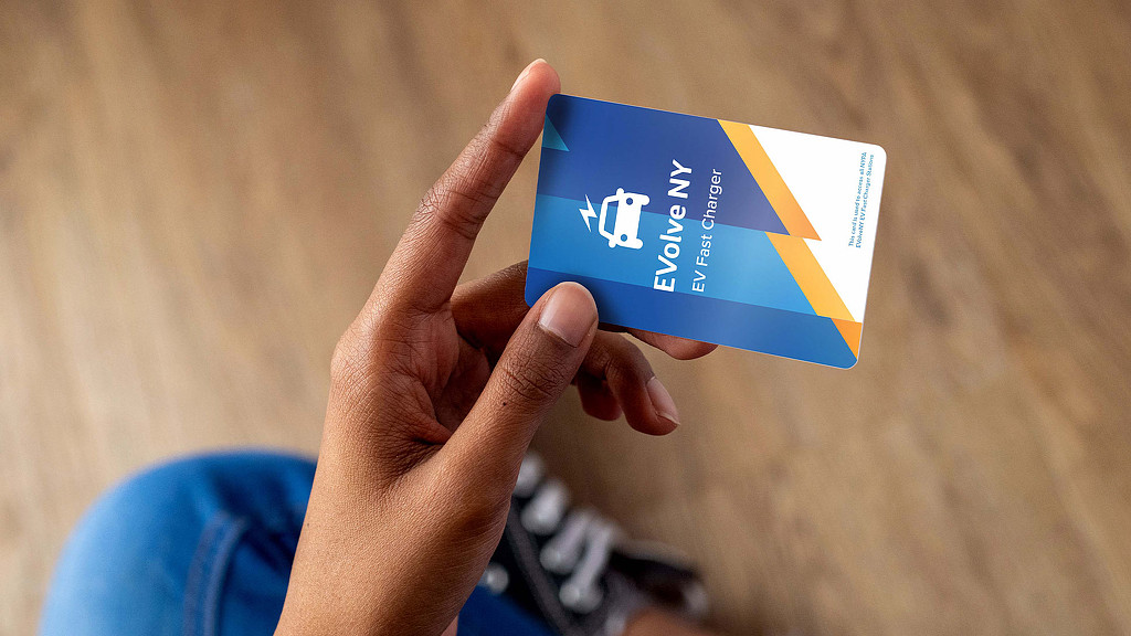 A hand holding a card.