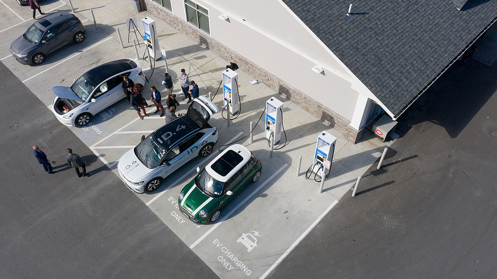 A group of cars parked on the side of a road.
