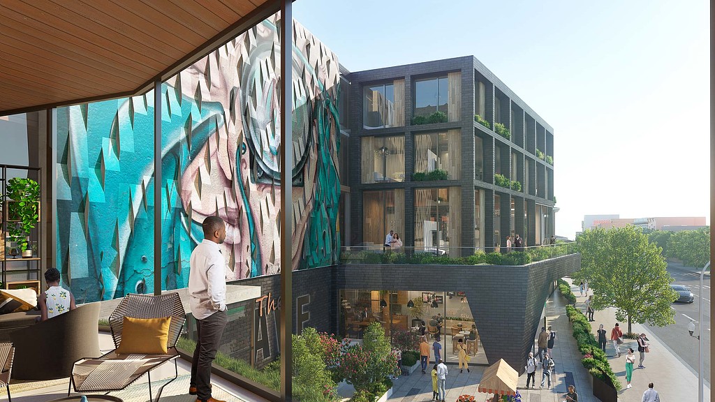 A person standing outside a building.