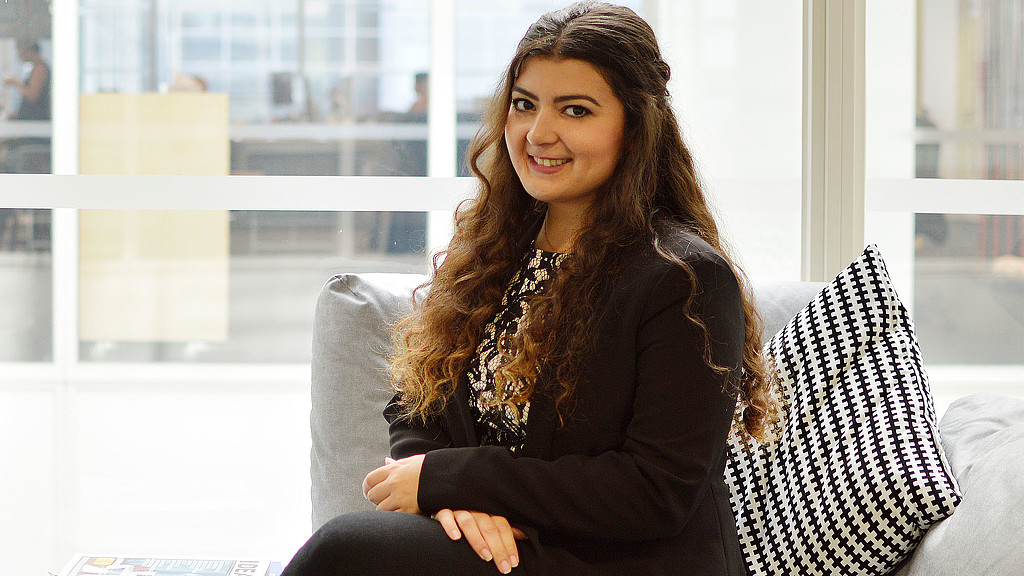 A woman sitting on a couch.