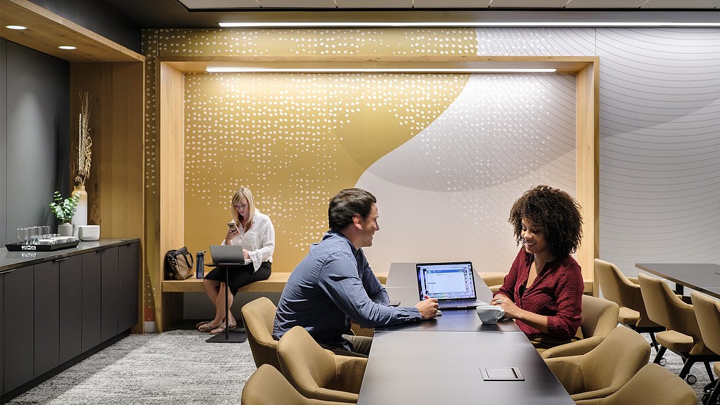 A few people sitting at a table.