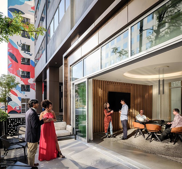 A group of people outside a building.