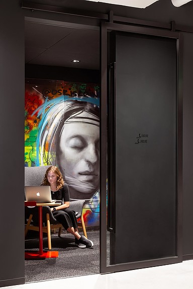 A person sitting at a desk with a laptop.