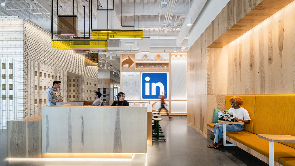 A group of people sitting at a table in a room.