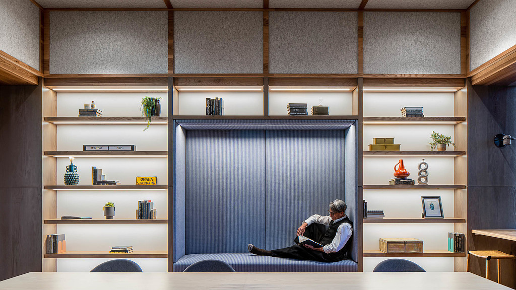 A person sitting on a couch.