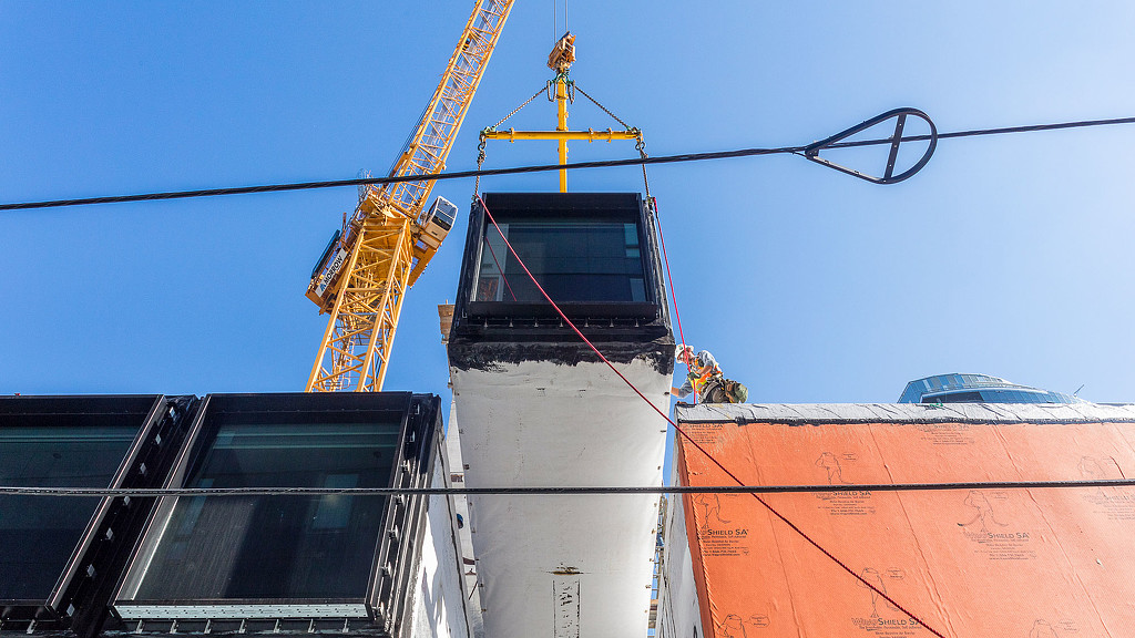 A crane on top of a building.