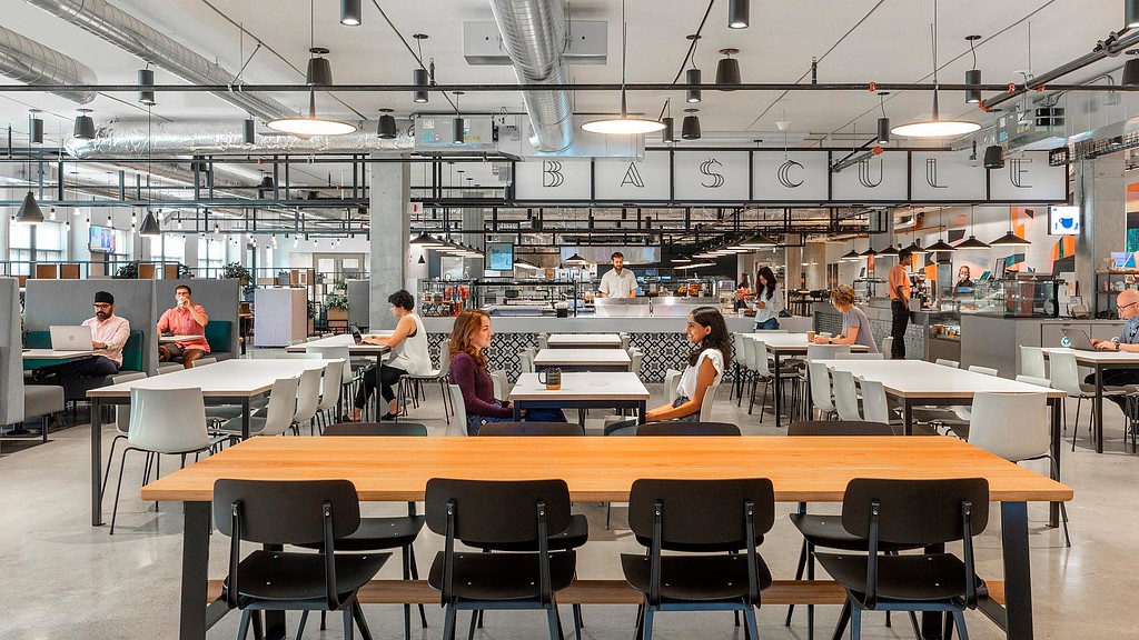 People sitting at tables in a room.