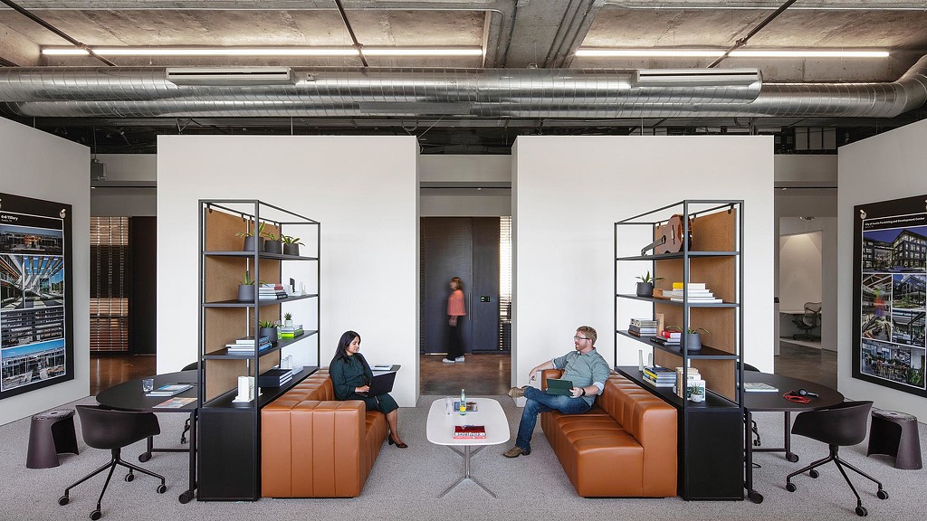 A few people in an office.