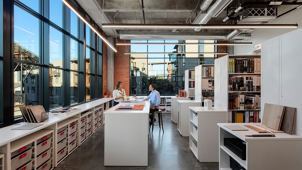 A man and a woman in an office.