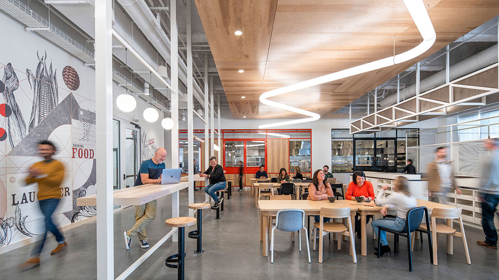 People sitting at tables in a building.