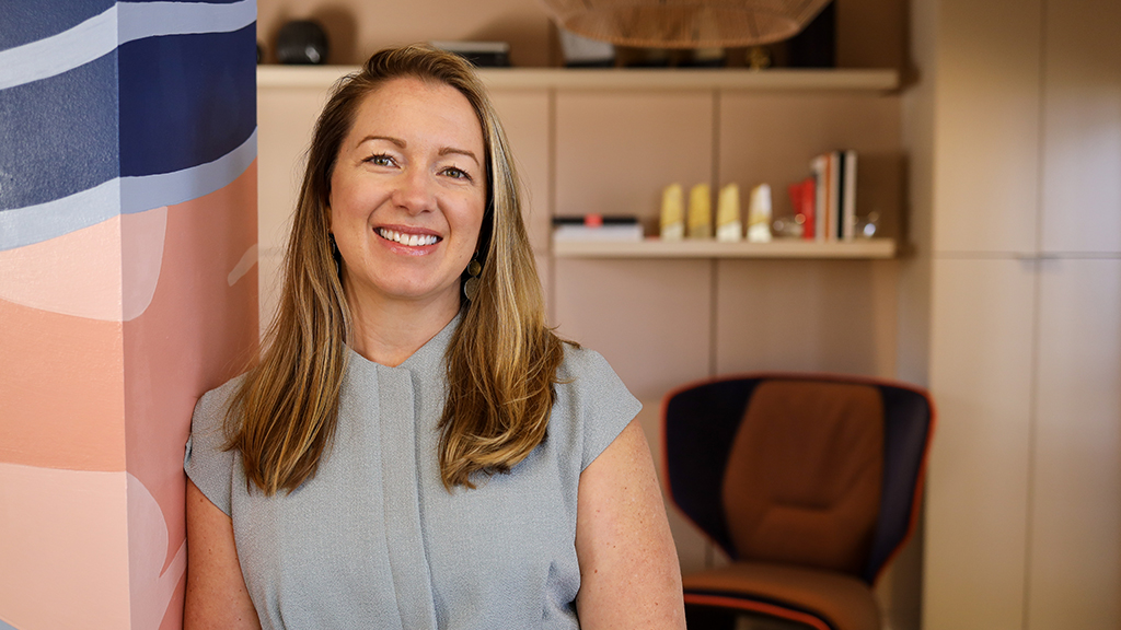 A woman smiling at the camera.