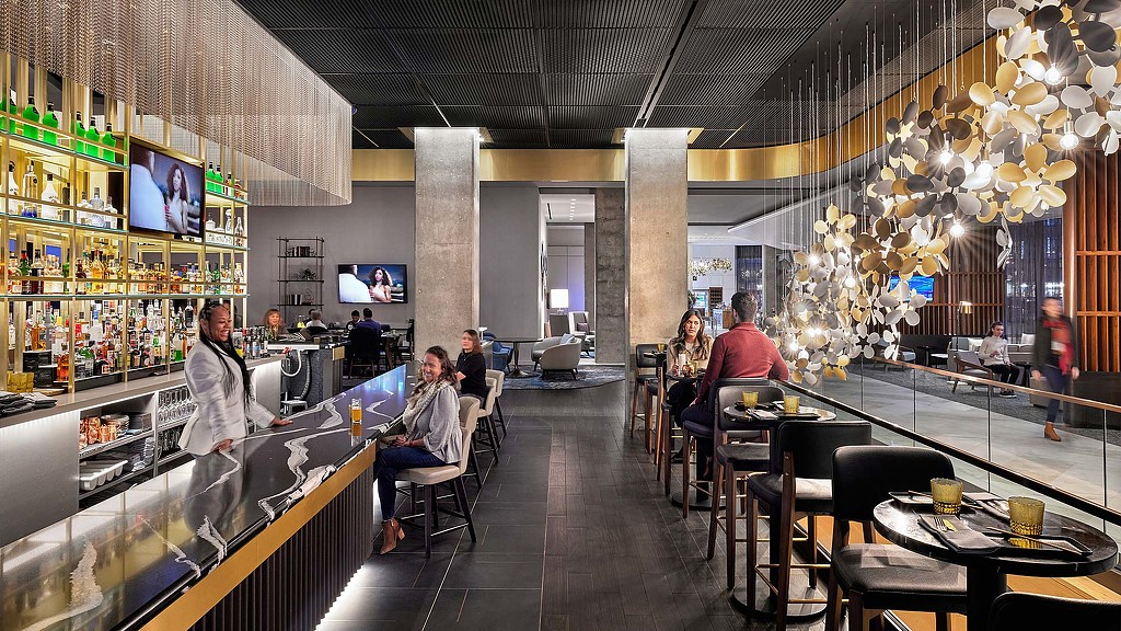 People sitting at tables in a restaurant.