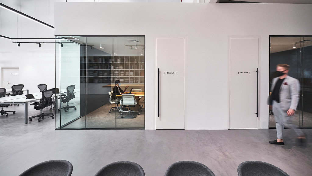 A person walking in a room.