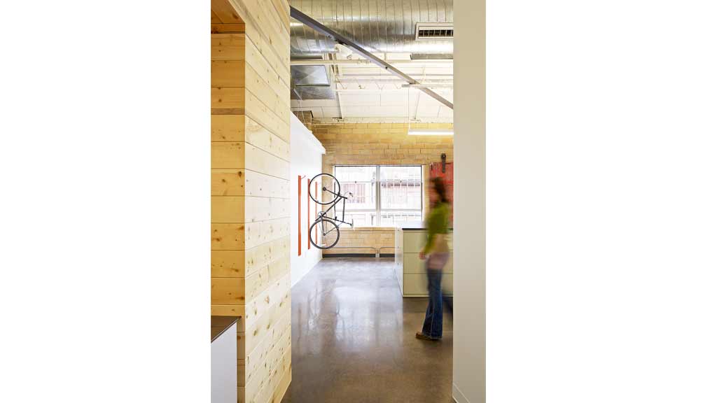 A person standing in a hallway.