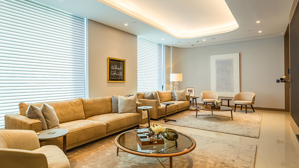 A living room with a couch and coffee table.