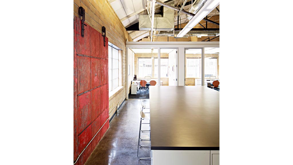 A long hallway with a few chairs.