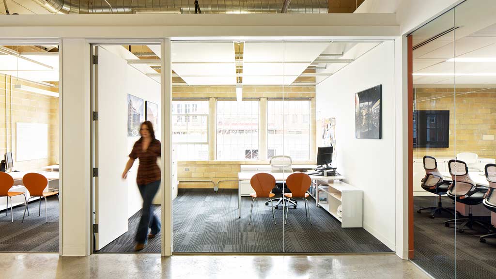 A person walking in a room.