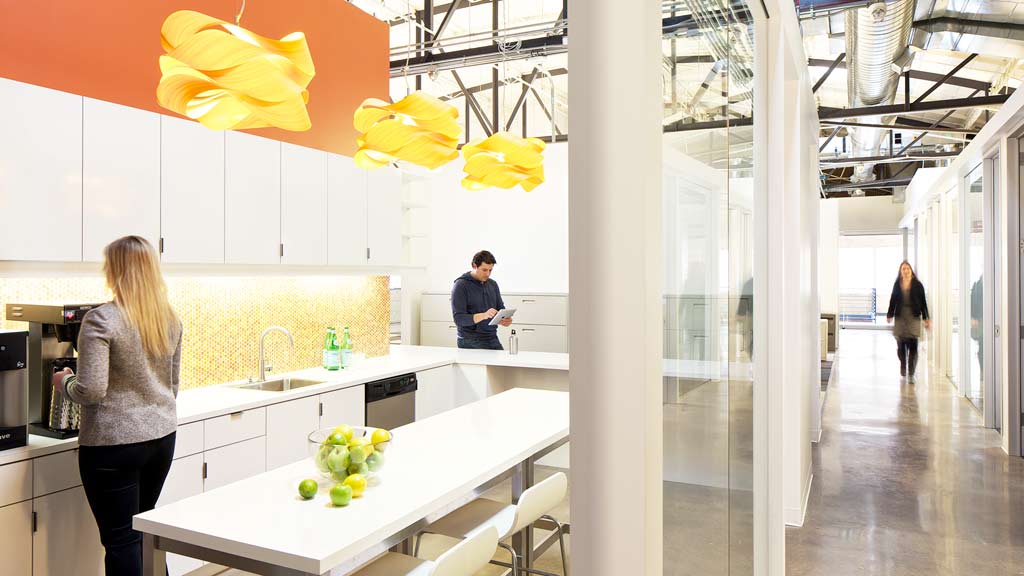 A person standing in a kitchen.