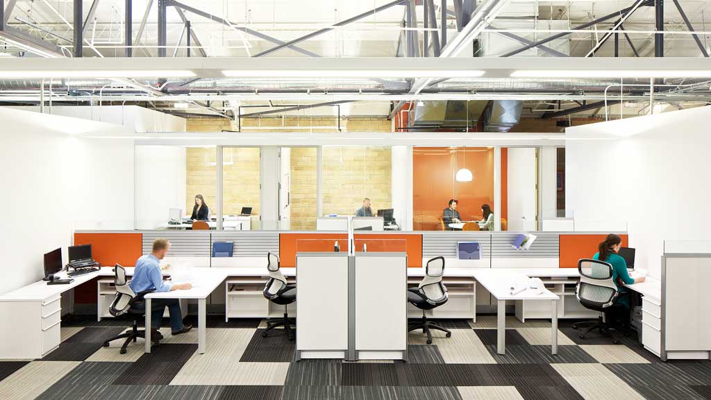 A group of people sitting at tables.