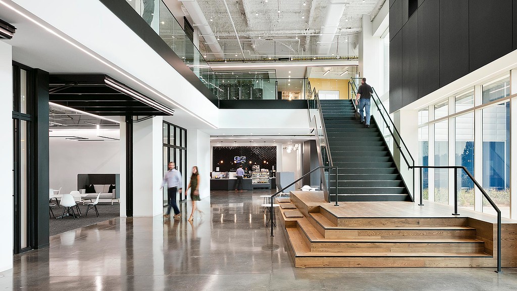 People walking down a hall.