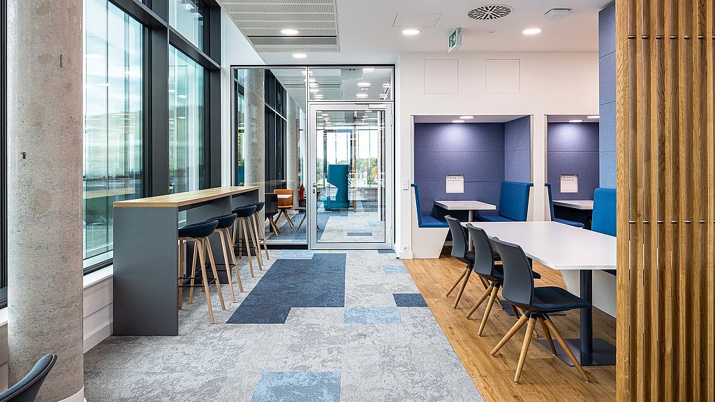 A room with tables and chairs.