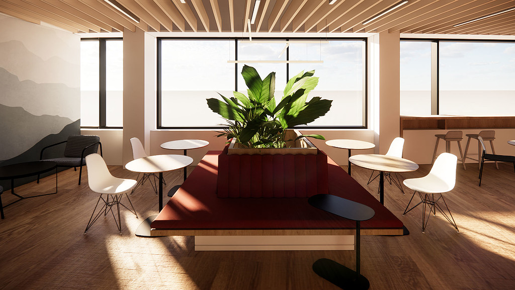 A room with a couch and tables.