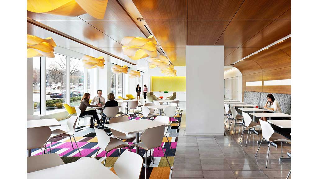 A group of people sitting at tables.