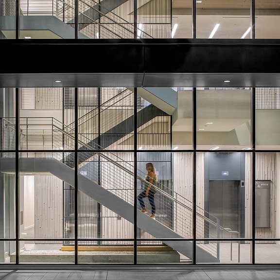 Twenty by Six stairwell seen through glass building exterior