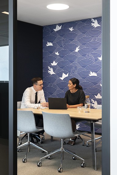 A man and woman meeting in Mizuho Bank office room