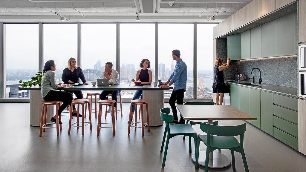 Employees sitting at Citrix Sydney office cafe bar table