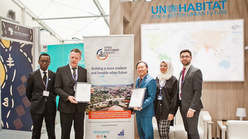 A group of people holding a certificate.