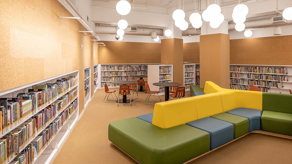 Brooklyn Public Library reading room with couch and tables