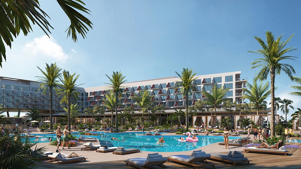 A large building with a pool and people in it.