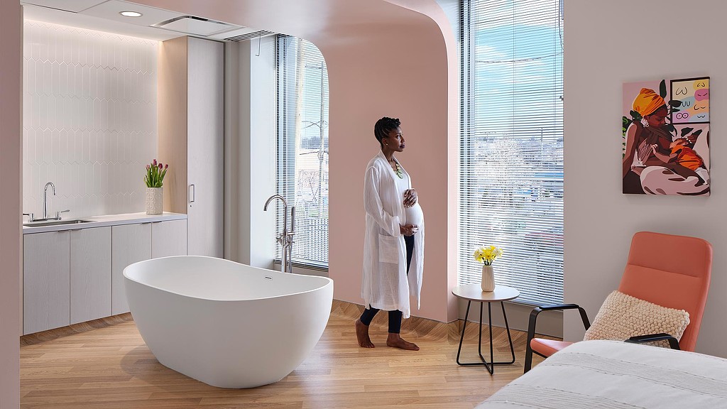 Expecting mother in Community of Hope room.