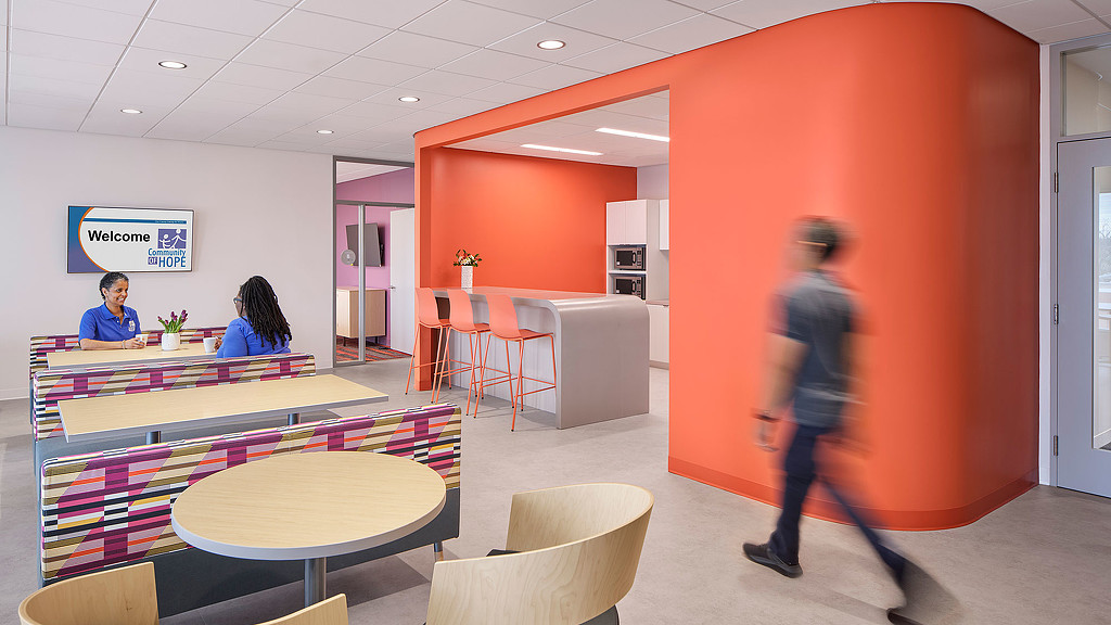 A person walking in a room.