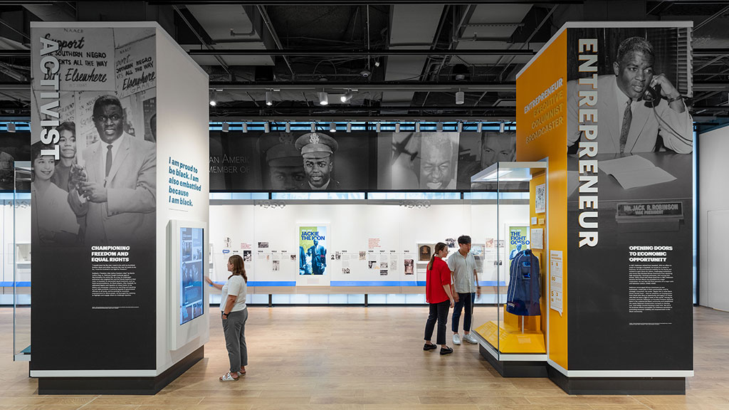 People standing in front of a display.