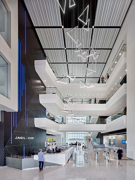 A group of people walking inside a building.