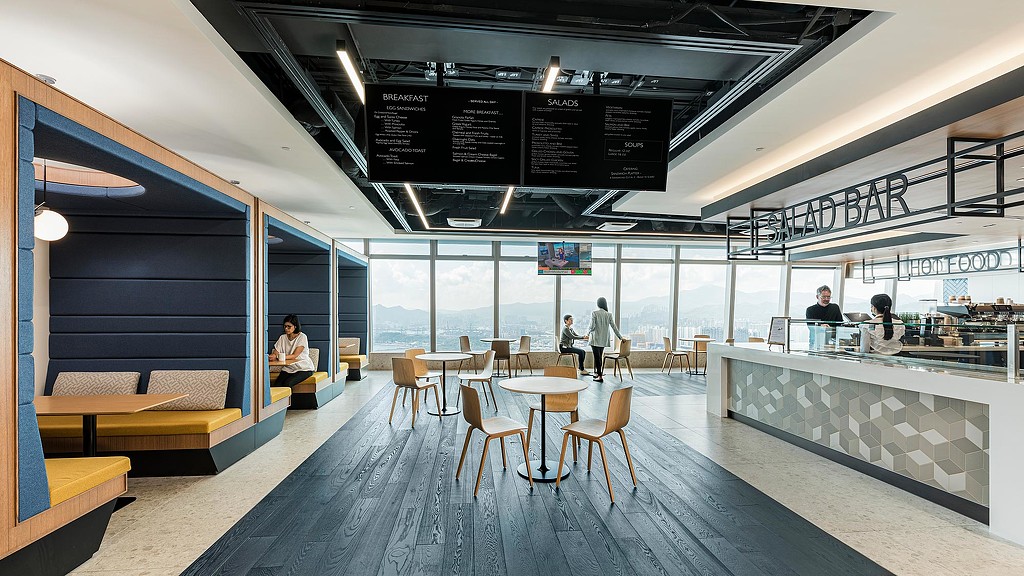 Confidential financial services client cafeteria with cafe seating.
