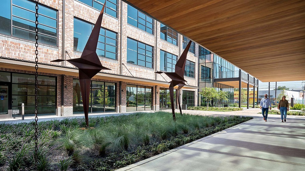The Center for Pursuit outdoor walkway with sculptures.