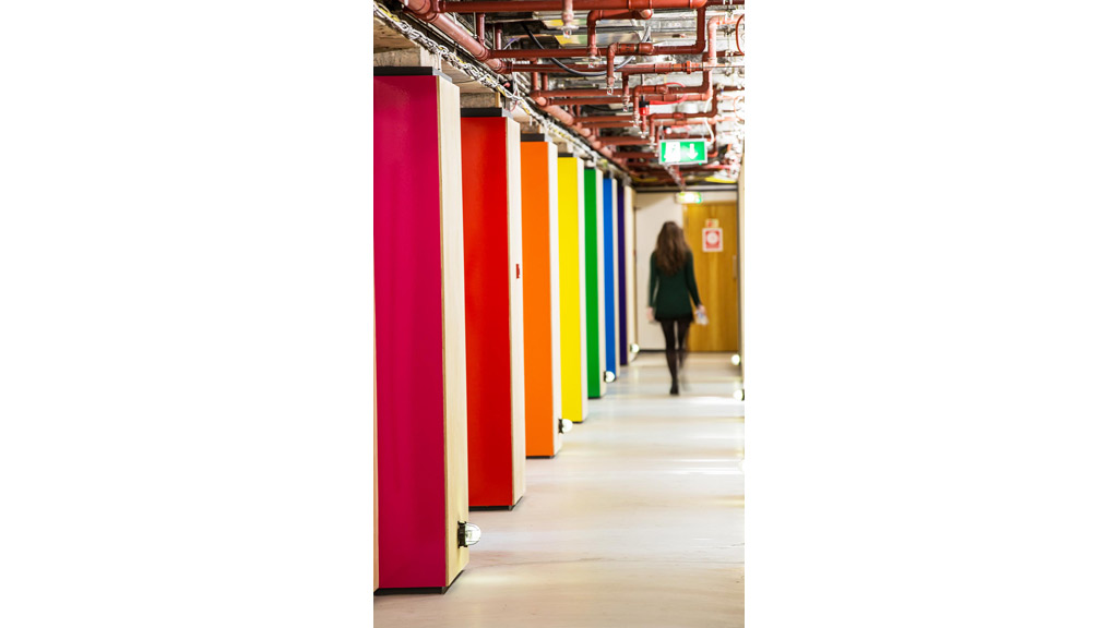 A person walking in a hallway.