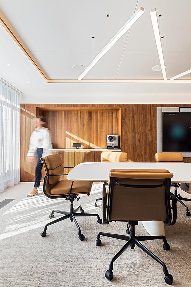 Woman walking in conference room.