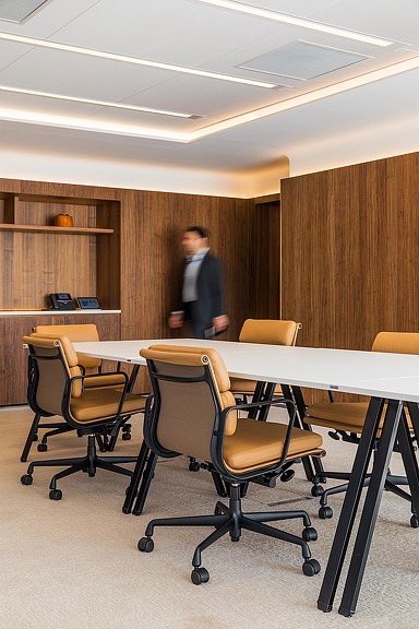 Man walking into conference room.