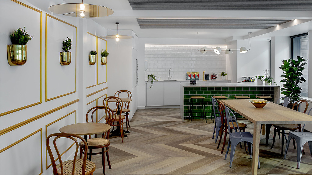 A room with tables and chairs.